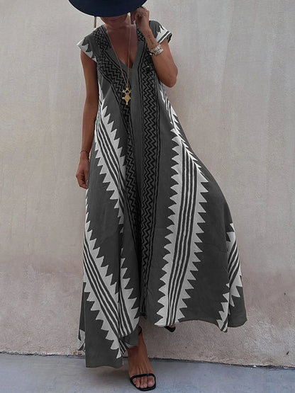 Vestido Boho Chic con Escote en V Profundo – Elegancia que Fluye con Cada Paso